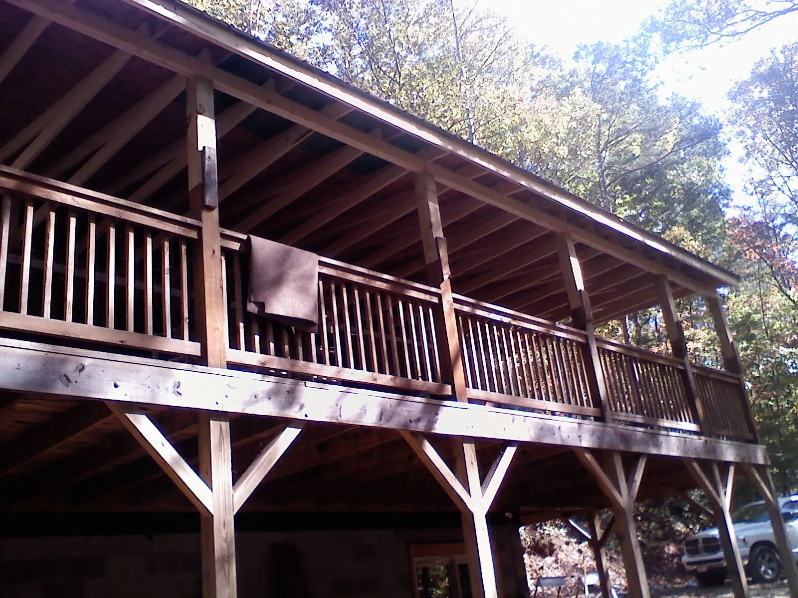 Timber framing under a new elevated porch and deck — Roof Leak Repair in Guernsey by Roofing Brothers